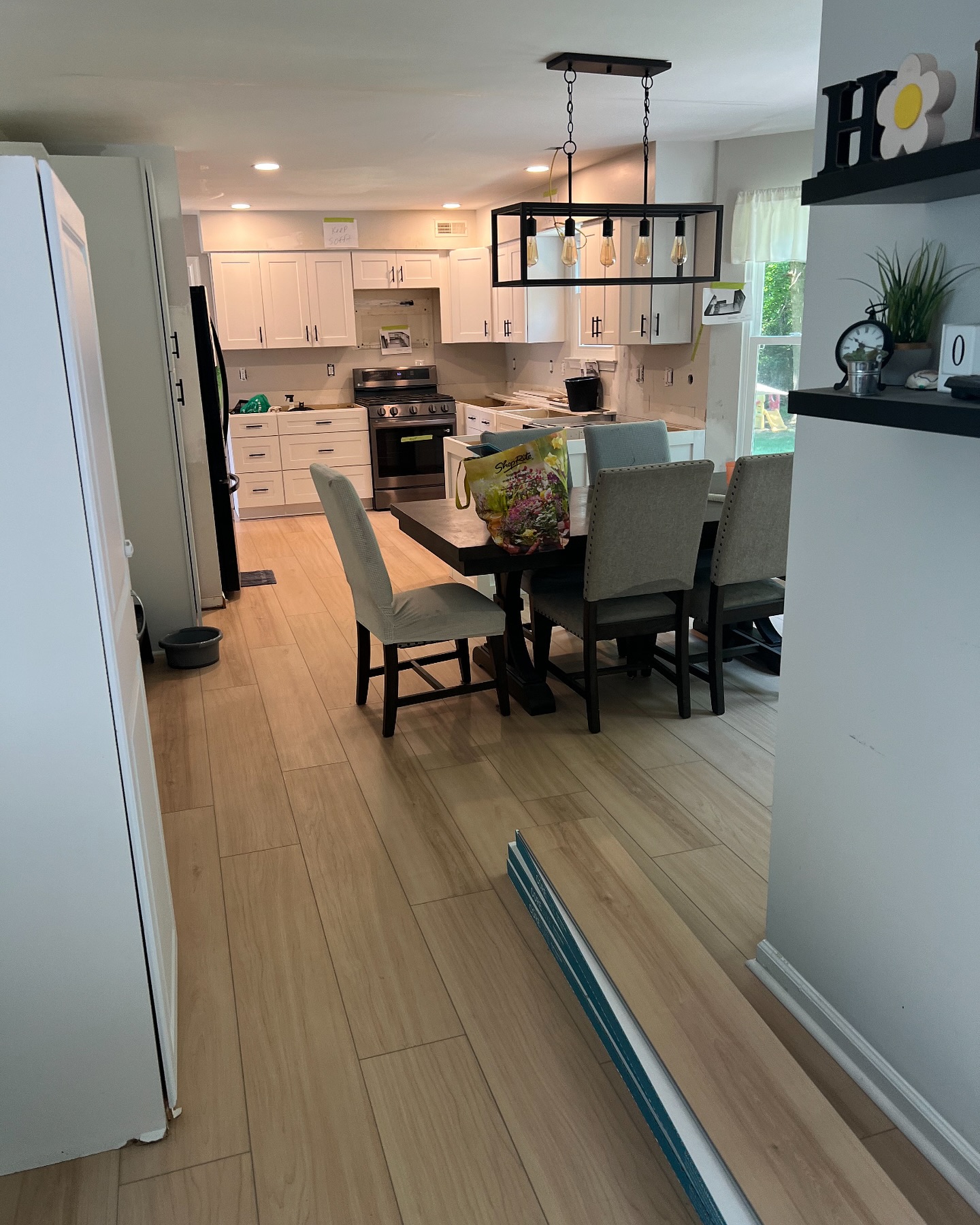 Light wood flooring in kitchen dining area