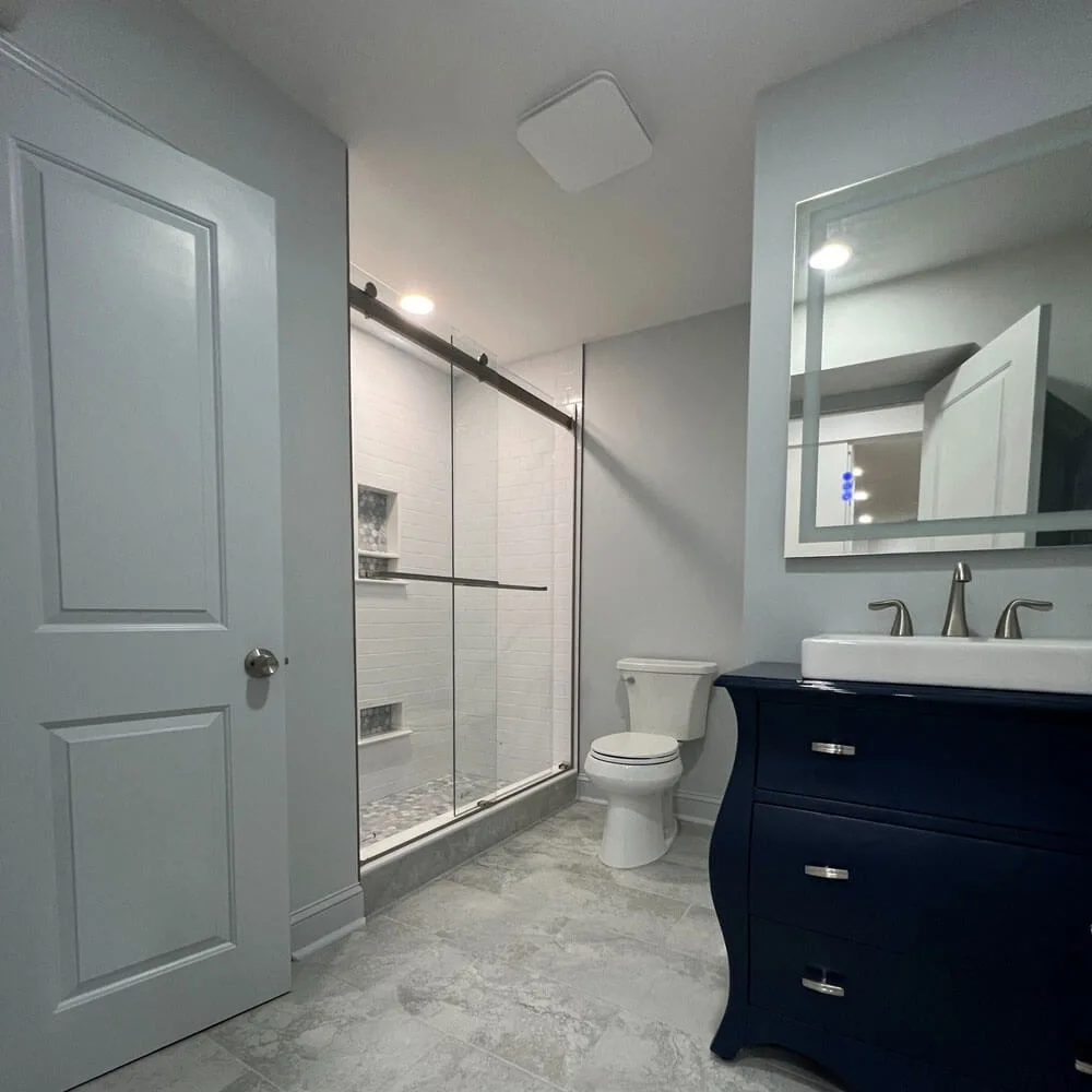 Tub-to-shower conversion in Washington Township, NJ, transforming an old bathtub into a modern walk-in shower.