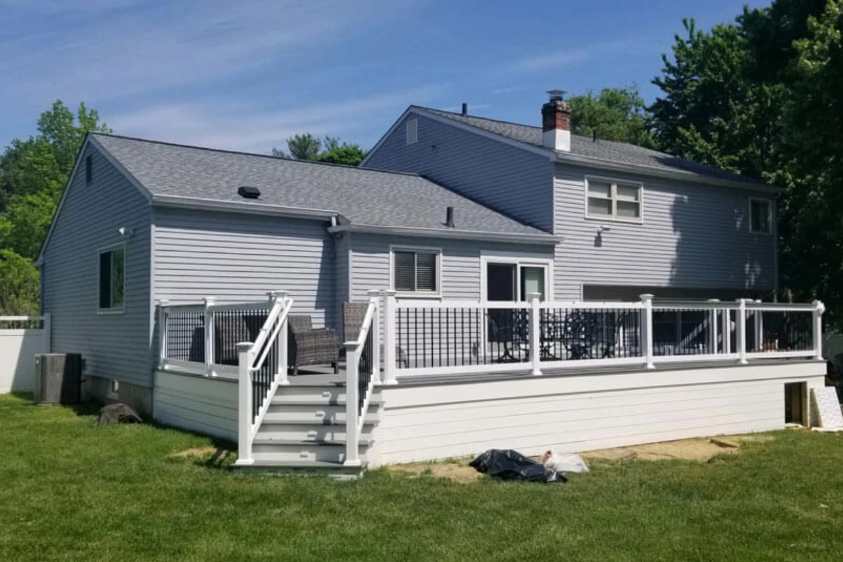 Newly renovated home exterior with elevated deck and railing, showcasing general contractor work in Williamstown, NJ.