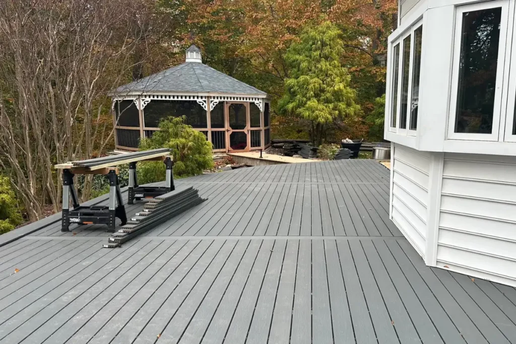 Gray composite deck with gazebo and surrounding trees, highlighting backyard deck construction in Washington Township NJ