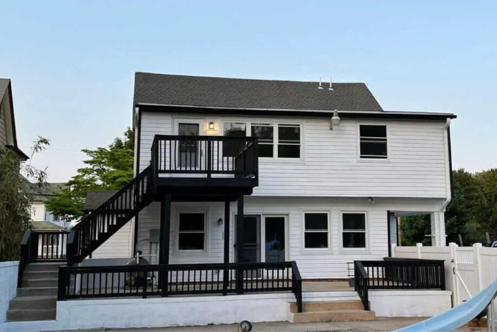 Siding installation in Washington Township, NJ with crew mounting new exterior cladding on home.
