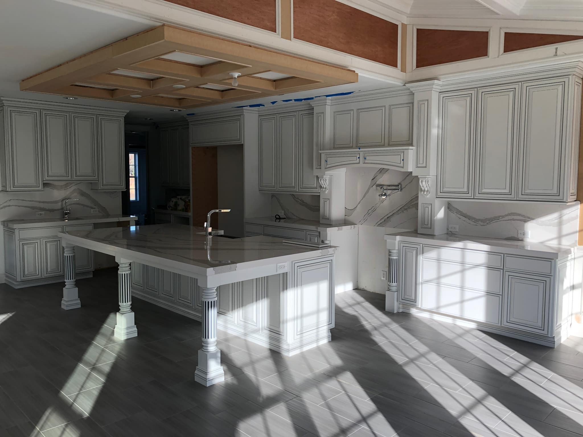 "Open-concept kitchen remodel featuring spacious layout, modern cabinetry, and seamless design flow"