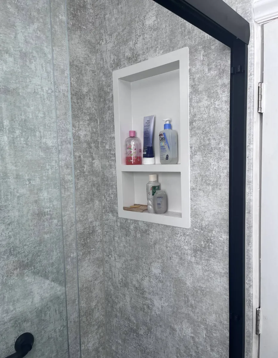 Recessed shower niche with toiletries in a Holmesburg walk-in shower remodel