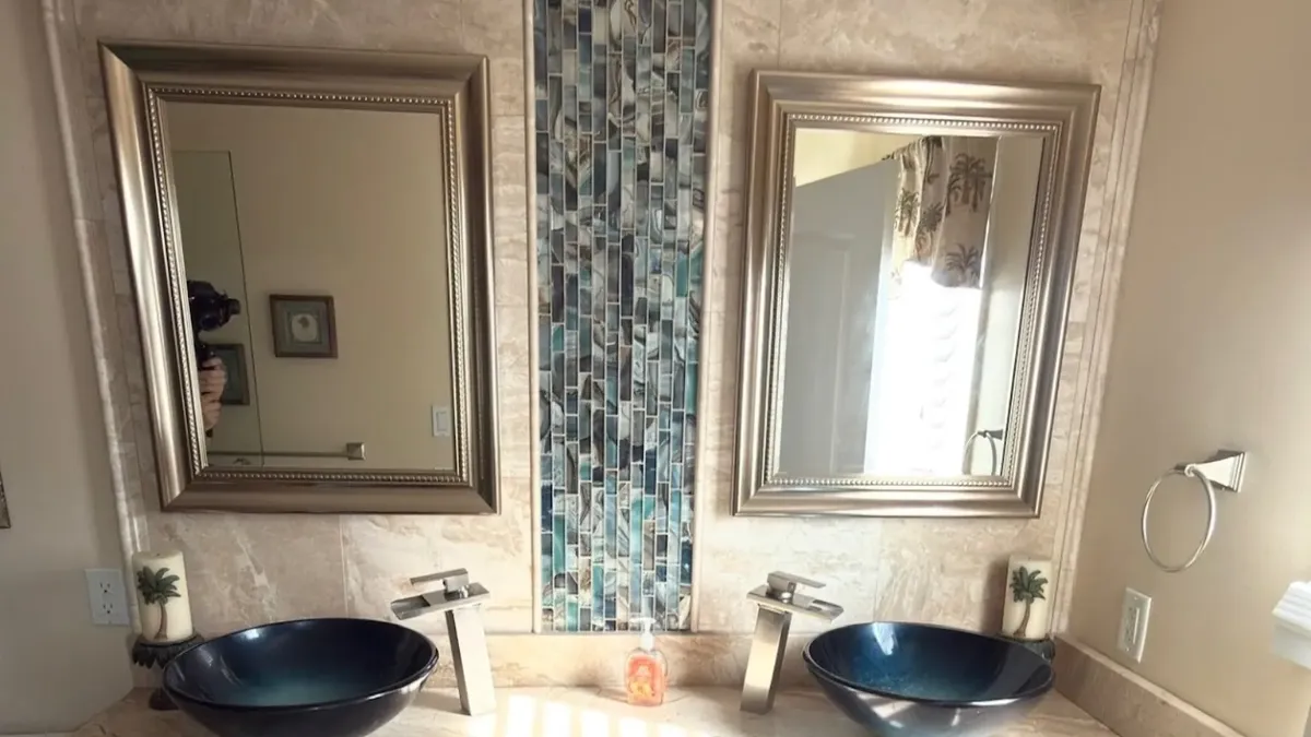 Full master bathroom remodel in Northeast Philadelphia with double vanity, glass vessel sinks, and stone counter