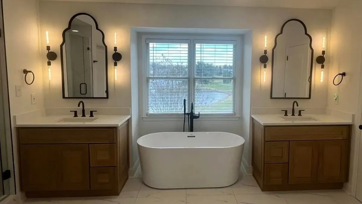 Luxury spa bathroom with freestanding soaking tub and dual vanities in Philadelphia remodel