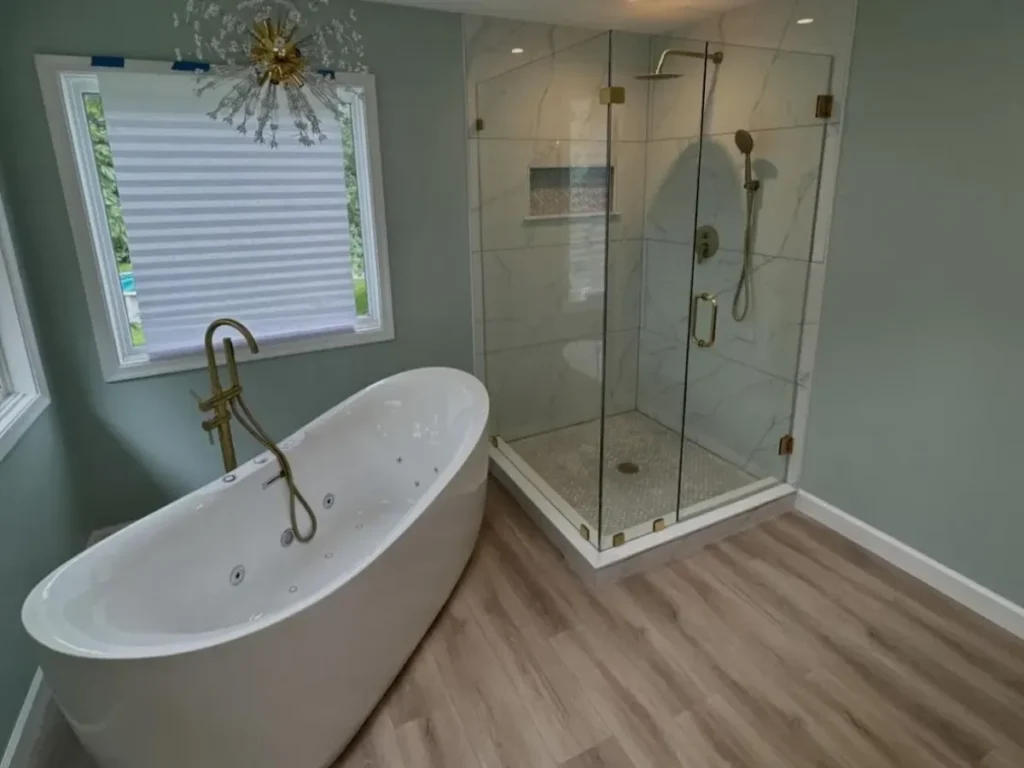 Wet room vs walk-in shower comparison - freestanding tub and frameless glass shower Philadelphia remodel