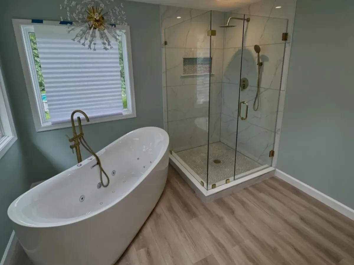Wet room vs walk-in shower comparison - freestanding tub and frameless glass shower Philadelphia remodel