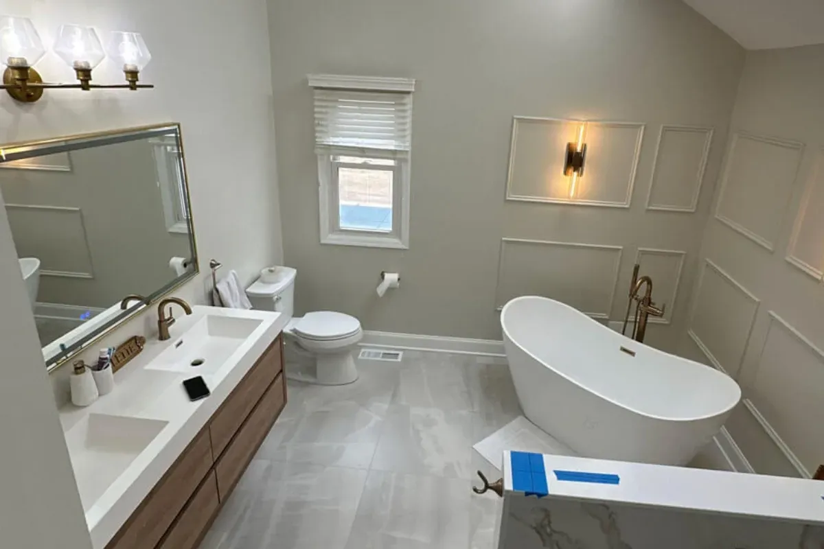 Long floating vanity across from a freestanding soaking tub in Northern Liberties, Philadelphia