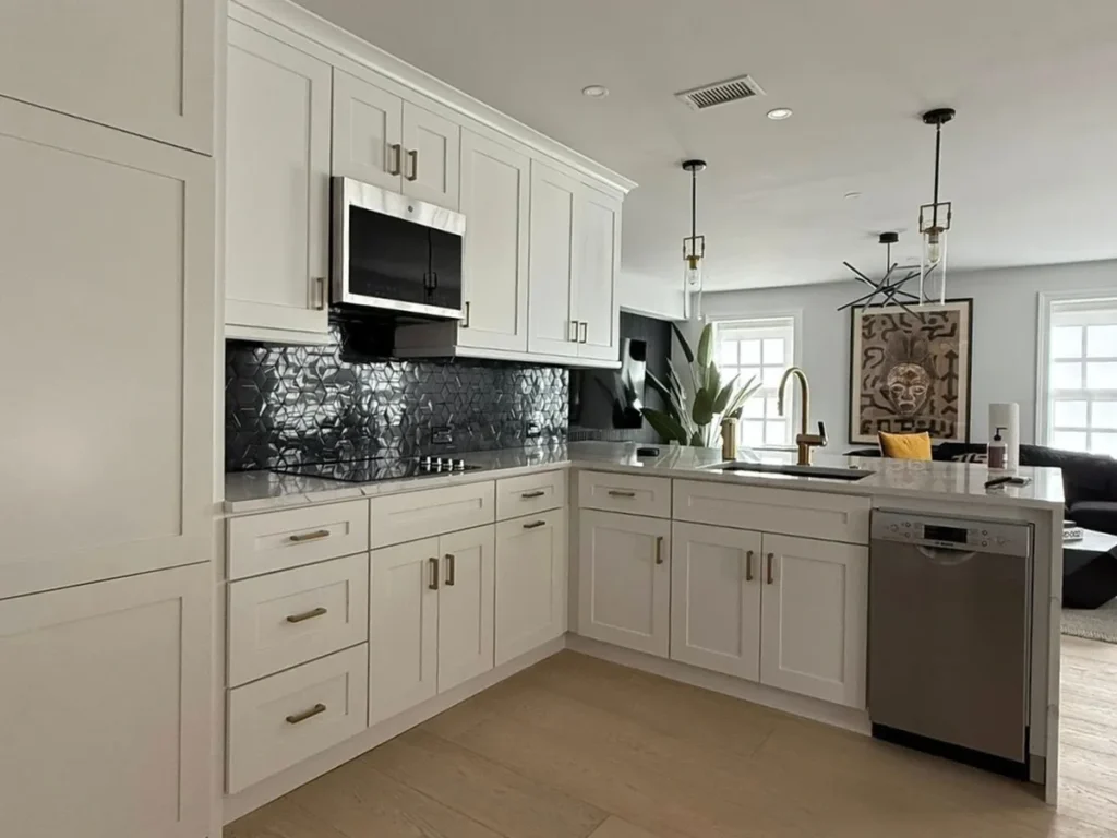 Philadelphia kitchen with a floor to ceiling pantry cabinet and a bank of deep drawers beside the range