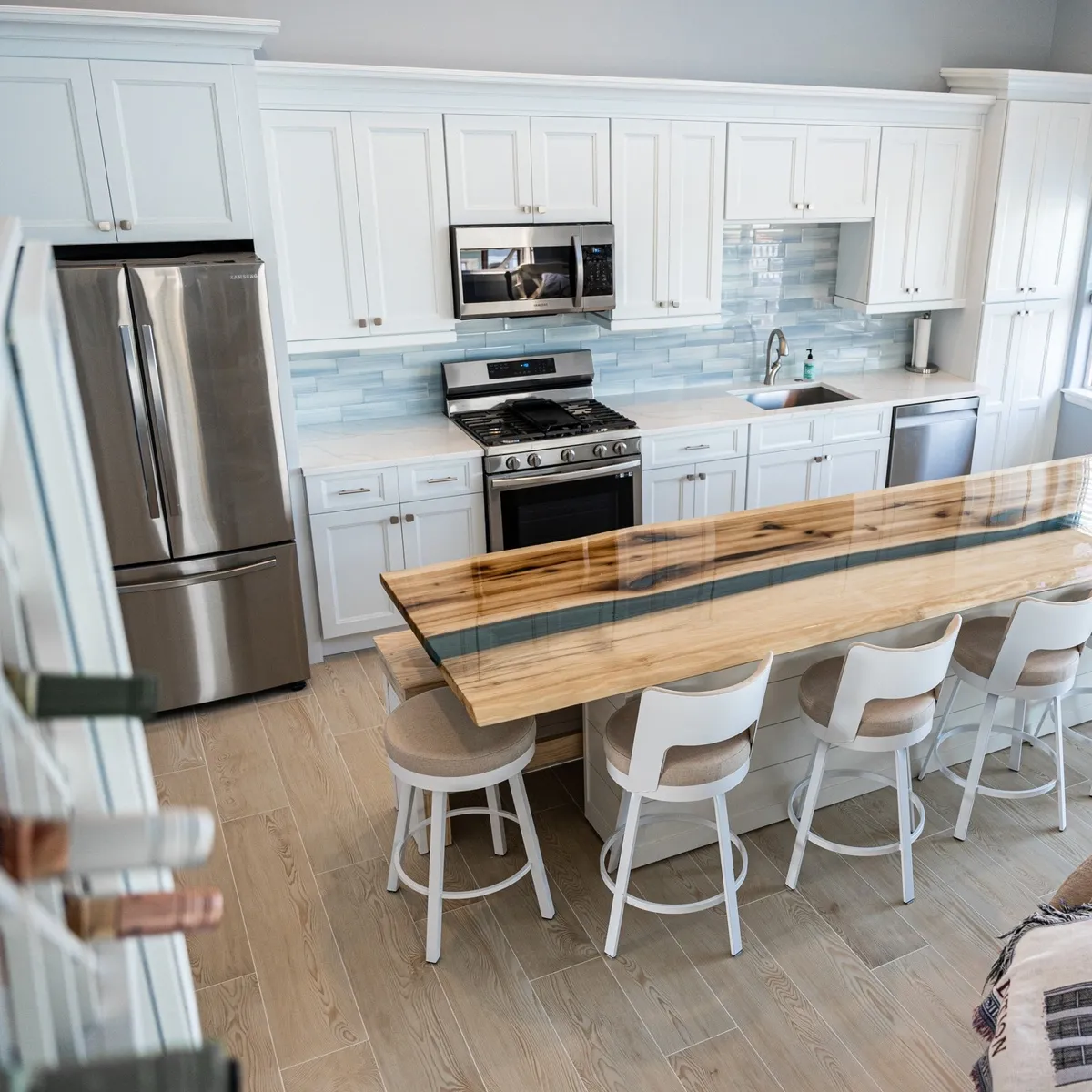 Finished white kitchen with wood island in a Philadelphia home remodeled by Showcase Remodels